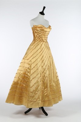 Lot 116 - An Antonio Castillo golden-yellow satin ball...