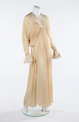Lot 144 - A Bill Gibb cream Quiana jersey evening dress,...