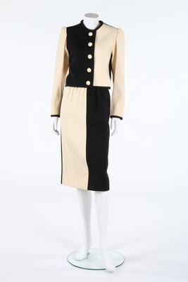 Lot 164 - An Yves Saint Laurent cream and black suit,...