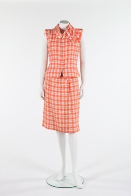 Lot 28 - A Chanel orange and white tweed ensemble, 2001,...