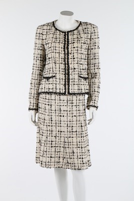 Lot 31 - A Chanel black and cream tweed suit, 2003,...