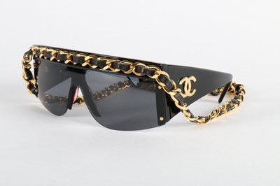 Lot 25 - A pair of Chanel sunglasses, 1991, the upper...