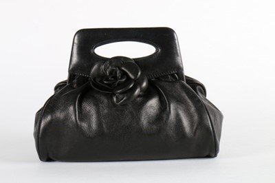 Lot 27 - A Chanel soft leather handbag with camelia...