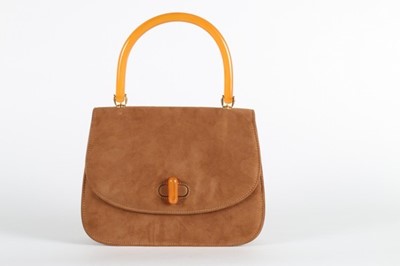 Lot 36 - A Gucci tan suede handbag, late 1960s, with...