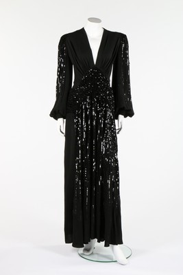 Lot 92 - A Gaston couture black sequined evening gown,...