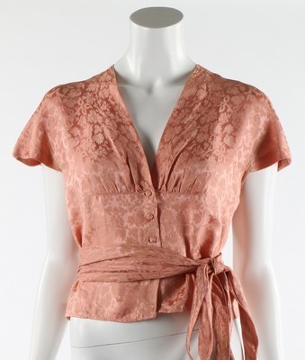 Lot 78 - A Balenciaga couture pale pink damask blouse,...