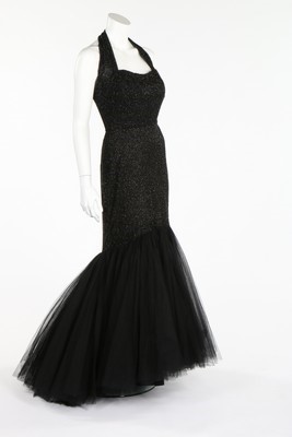 Lot 103 - A black beaded tulle couture evening gown,...