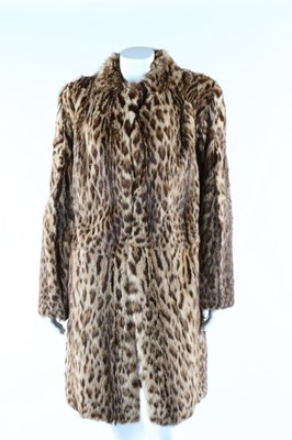 Lot 56 - A baby leopard skin coat, 1944, with original...