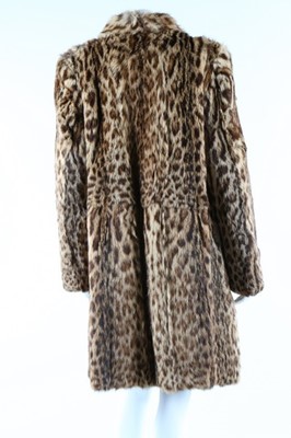 Lot 56 - A baby leopard skin coat, 1944, with original...