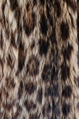 Lot 56 - A baby leopard skin coat, 1944, with original...