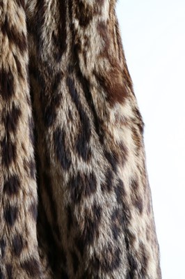 Lot 56 - A baby leopard skin coat, 1944, with original...
