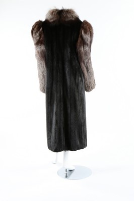 Lot 58 - A black mink and fox fur coat, 1980s, labelled...