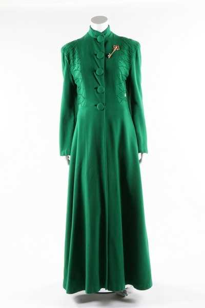 Lot 62 - A full-length green wool evening coat with...