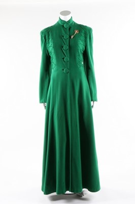 Lot 62 - A full-length green wool evening coat with...