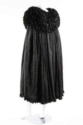 Lot 63 - An unusual black figured silk cape with...