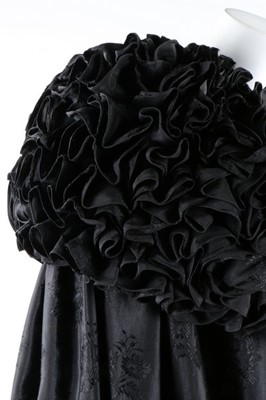 Lot 63 - An unusual black figured silk cape with...