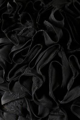 Lot 63 - An unusual black figured silk cape with...
