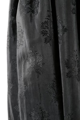 Lot 63 - An unusual black figured silk cape with...