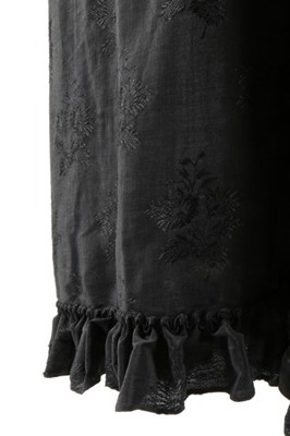 Lot 63 - An unusual black figured silk cape with...