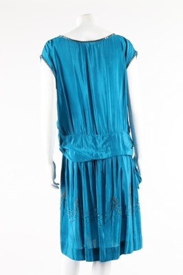 Lot 111 - A petrol-blue crepe dress with silver beading...