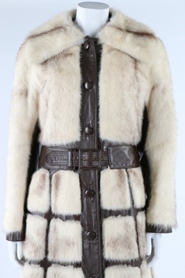 Lot 121 - A mink coat with brown leather trim, circa...