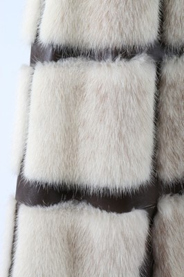 Lot 121 - A mink coat with brown leather trim, circa...