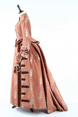 Lot 132 - A brocaded cinnamon taffeta gown, circa 1876,...