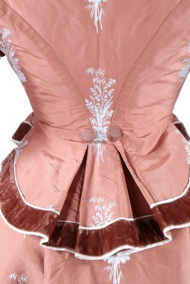 Lot 132 - A brocaded cinnamon taffeta gown, circa 1876,...