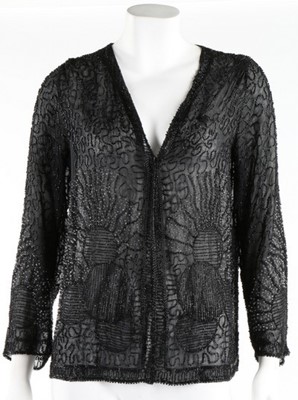 Lot 135 - A beaded black muslin flapper dress, circa...