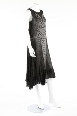 Lot 135 - A beaded black muslin flapper dress, circa...