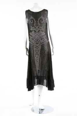 Lot 135 - A beaded black muslin flapper dress, circa...
