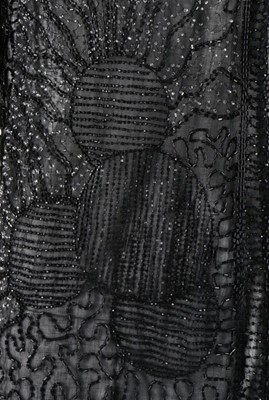 Lot 135 - A beaded black muslin flapper dress, circa...