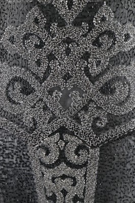 Lot 135 - A beaded black muslin flapper dress, circa...