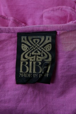 Lot 149 - A Biba pink and silver lurex halter-neck dress...