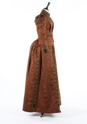 Lot 213 - A brown moire dress, circa 1890, comprising...