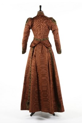 Lot 213 - A brown moire dress, circa 1890, comprising...