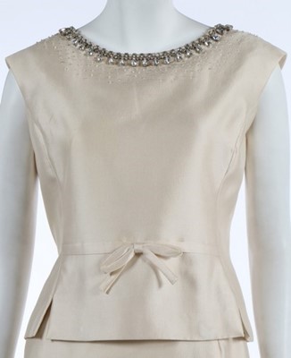 Lot 214 - A Christian Dior ivory silk evening ensemble,...