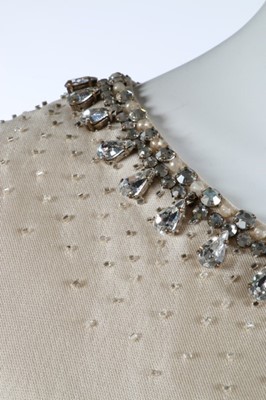 Lot 214 - A Christian Dior ivory silk evening ensemble,...