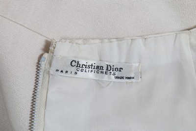 Lot 214 - A Christian Dior ivory silk evening ensemble,...