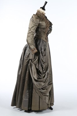 Lot 226 - A striped grey satin dress circa 1890,...