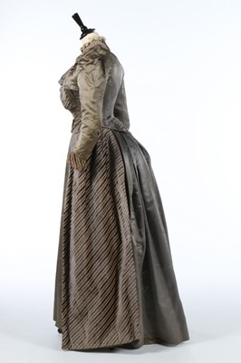 Lot 226 - A striped grey satin dress circa 1890,...