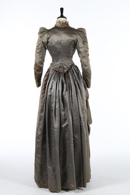 Lot 226 - A striped grey satin dress circa 1890,...