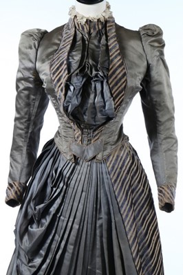 Lot 226 - A striped grey satin dress circa 1890,...