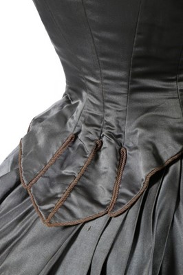 Lot 226 - A striped grey satin dress circa 1890,...