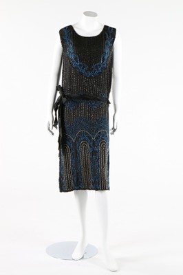 Lot 237 - A beaded black crepe de chine flapper dress,...