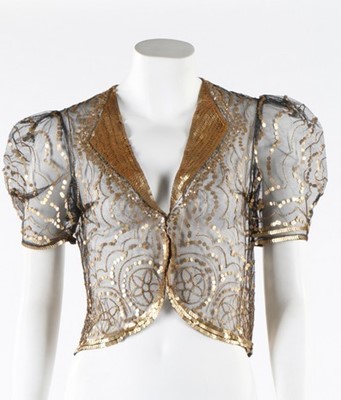 Lot 256 - A gold sequined black tulle evening jacket,...