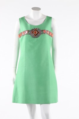 Lot 292 - A Pierre Cardin beaded green silk cocktail...