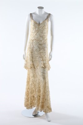 Lot 301 - A figurative ivory silk lace evening gown, mid...