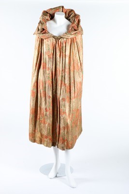 Lot 313 - A Liberty printed gold lamé evening cape,...