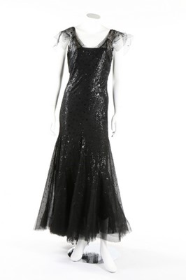Lot 319 - A black sequined full-length evening gown,...